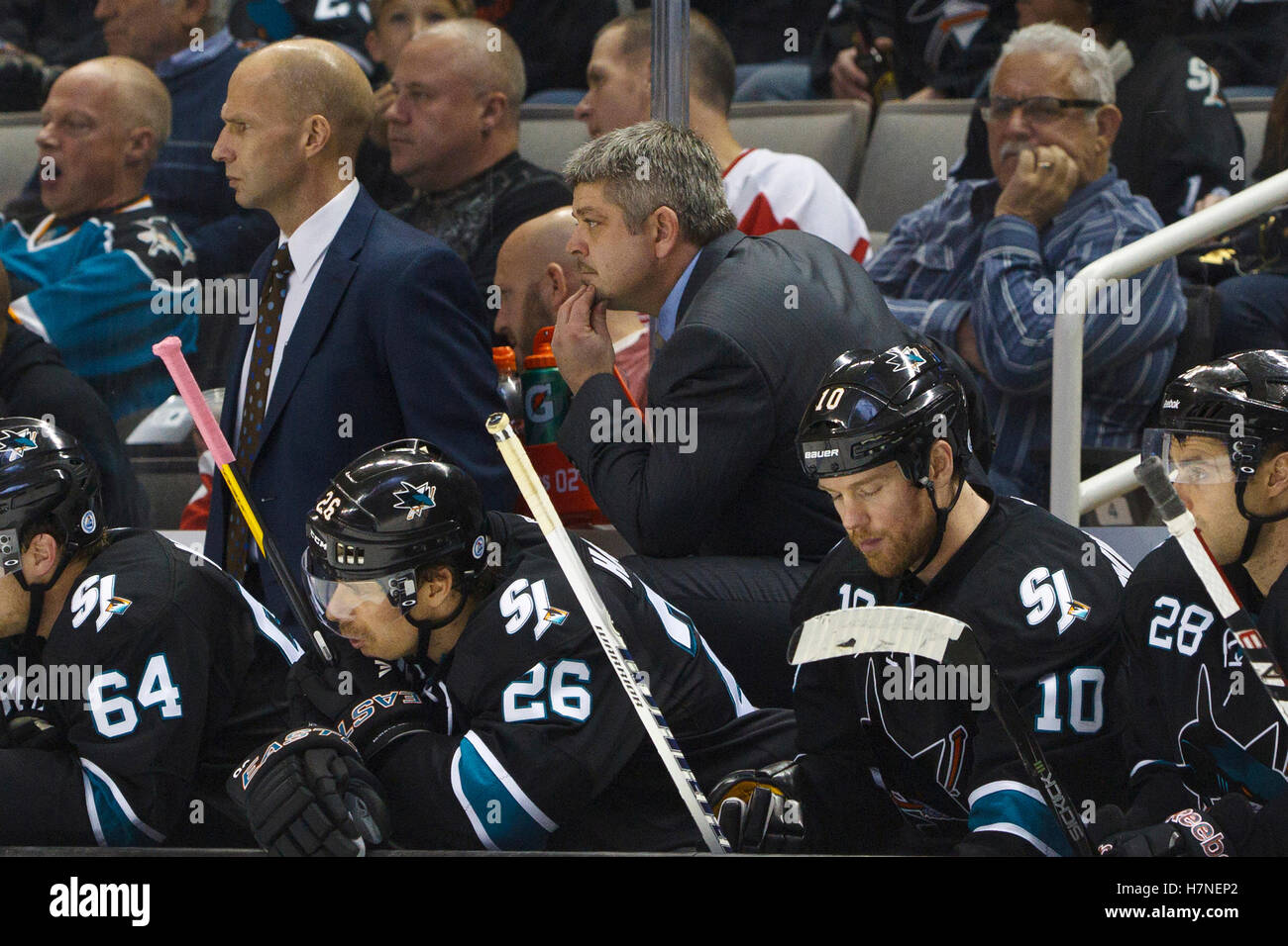 Nov 17, 2011; San Jose, CA, USA; San Jose Sharks head coach Todd McLellan stands behind the bench against the Detroit Red Wings during the third period at HP Pavilion. San Jose defeated Detroit 5-2. Stock Photo