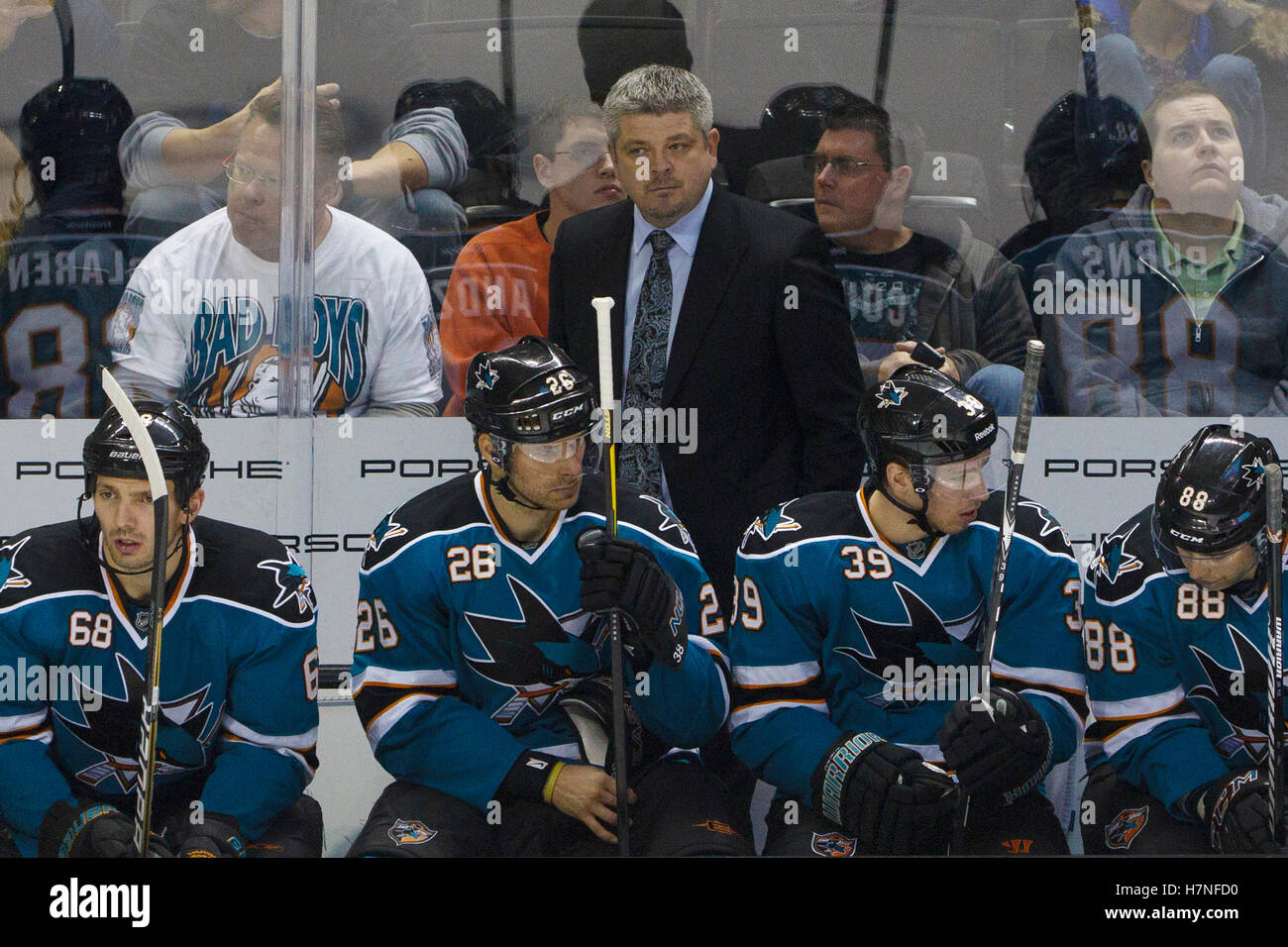 Dec 8, 2011; San Jose, CA, USA; San Jose Sharks head coach Todd McLellan stands behind on the bench against the Dallas Stars during the second period at HP Pavilion.  San Jose defeated Dallas 5-2. Stock Photo