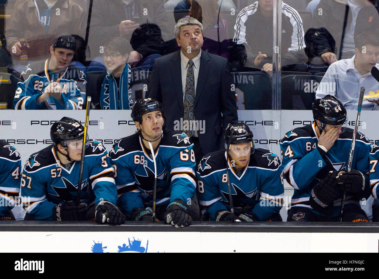 Jan 17, 2012; San Jose, CA, USA; San Jose Sharks head coach Todd McLellan stands behind the bench against the Calgary Flames during the third period at HP Pavilion. San Jose defeated Calgary 2-1 in shootouts. Stock Photo