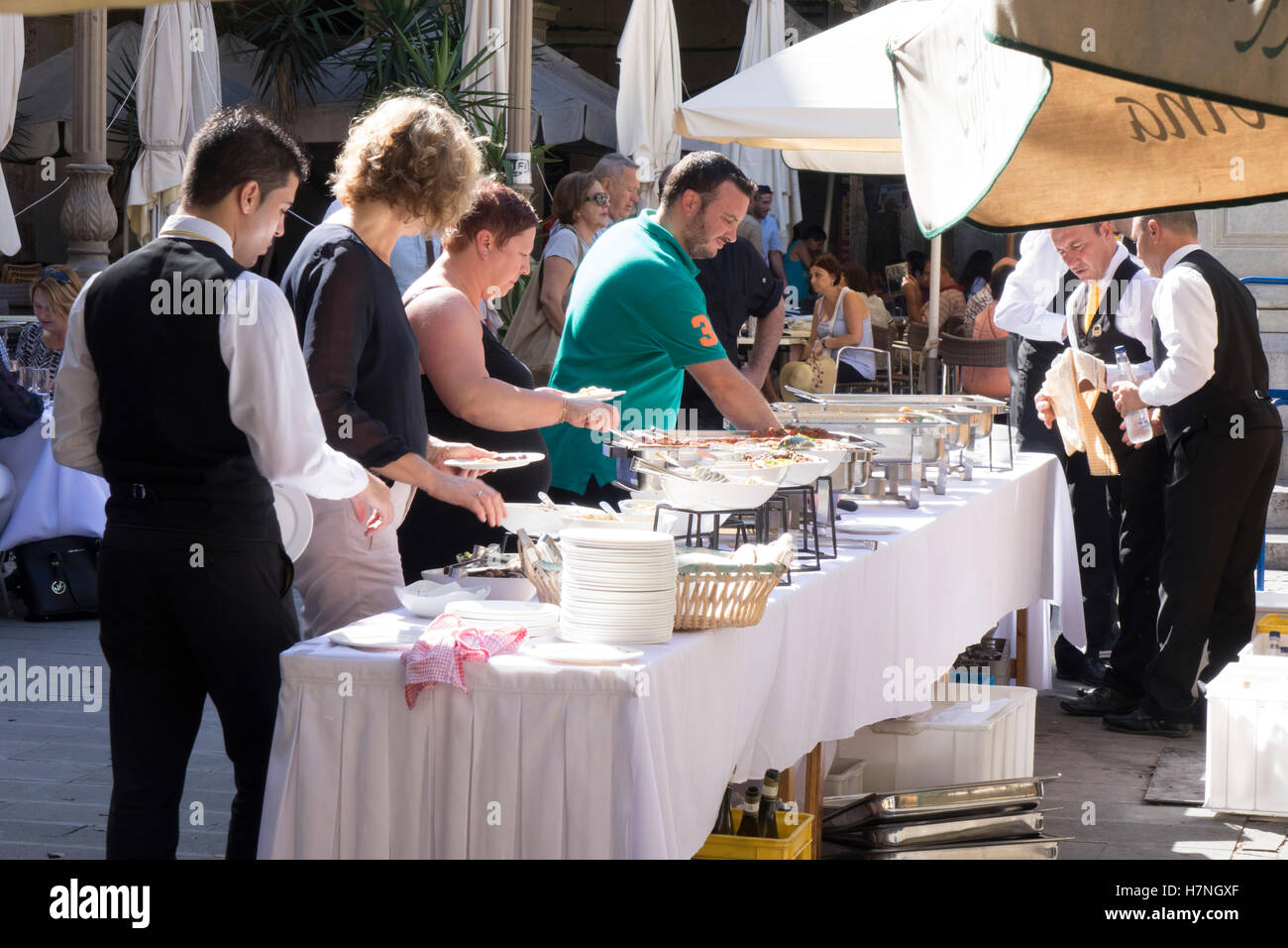 Valletta, walled capital city port of Malta. Outdoor buffet served by the Cafe Cordina. Stock Photo