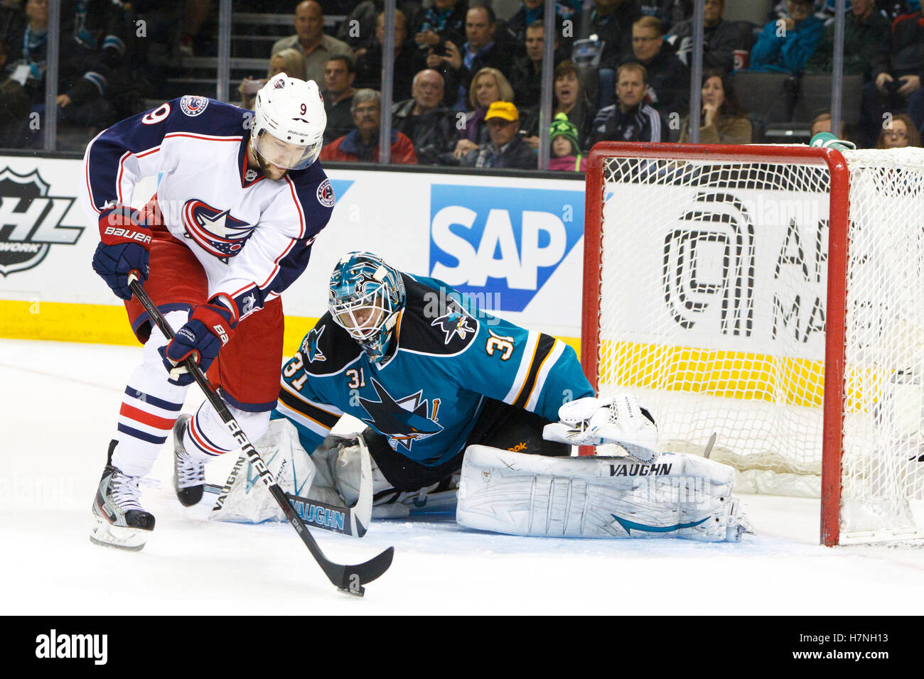 Jan 31, 2012; San Jose, CA, USA; San Jose Sharks goalie Antti Niemi (31) defends his goal in front of Columbus Blue Jackets left wing Colton Gillies (9) during the first period at HP Pavilion. Stock Photo