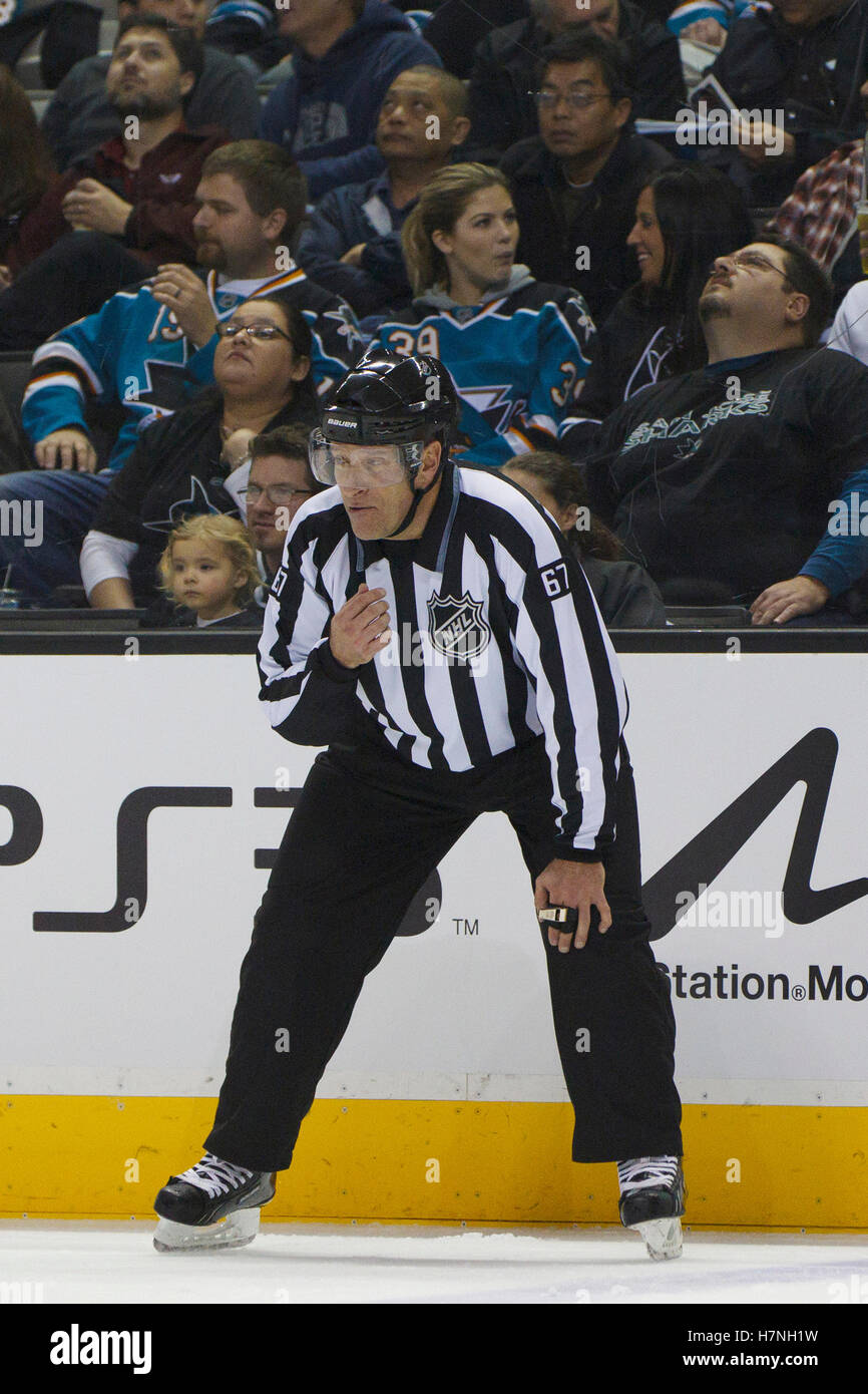 Jan 31, 2012; San Jose, CA, USA; NHL linesman Pierre Champoux (67) before a face off between the San Jose Sharks and the Columbus Blue Jackets during the first period at HP Pavilion. San Jose defeated Columbus 6-0. Stock Photo
