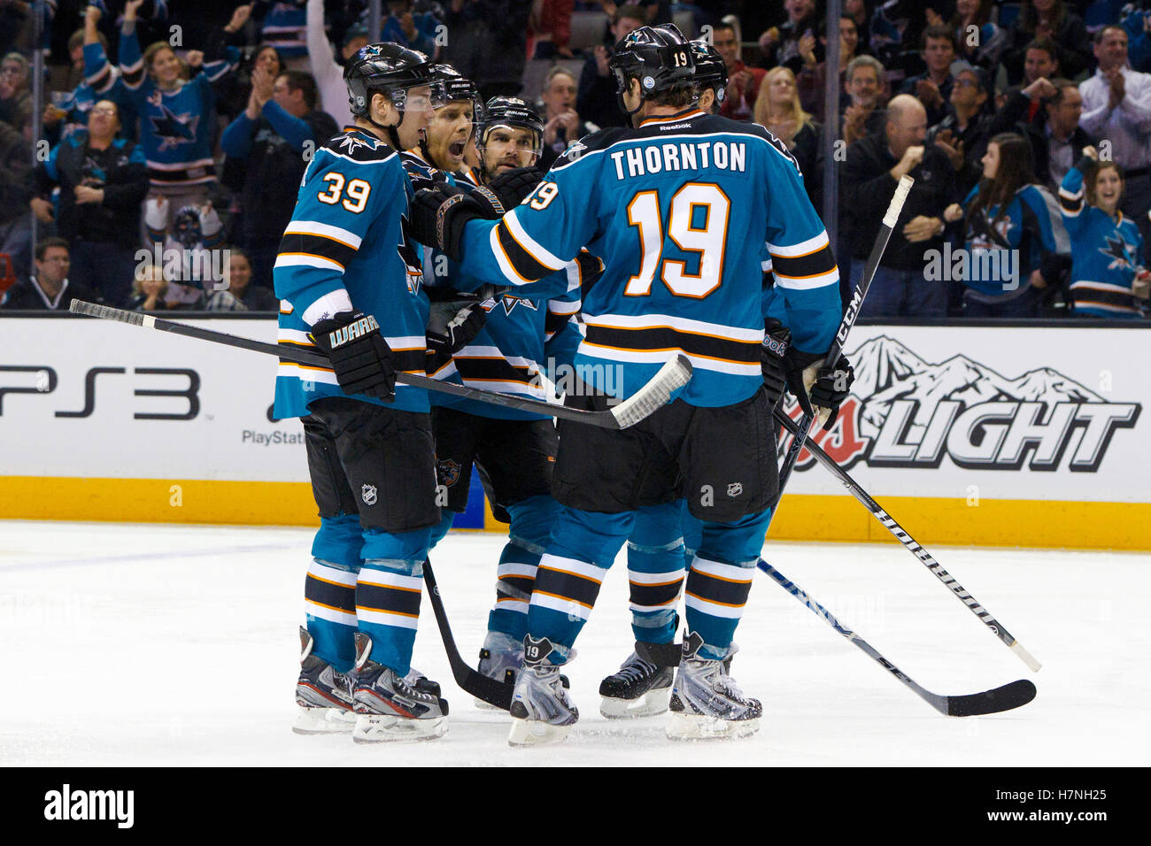Jan 31, 2012; San Jose, CA, USA; San Jose Sharks center Joe Pavelski (second from left) is congratulated by teammates after scoring a goal against the Columbus Blue Jackets during the second period at HP Pavilion. Stock Photo