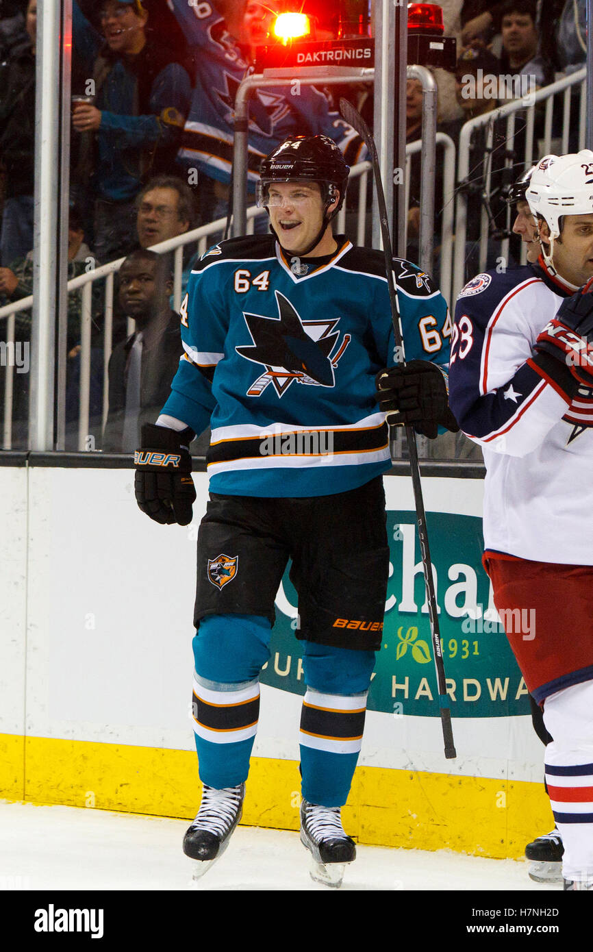 Jan 31, 2012; San Jose, CA, USA; San Jose Sharks left wing Jamie McGinn (64) celebrates after scoring a goal against the Columbus Blue Jackets during the second period at HP Pavilion. Stock Photo
