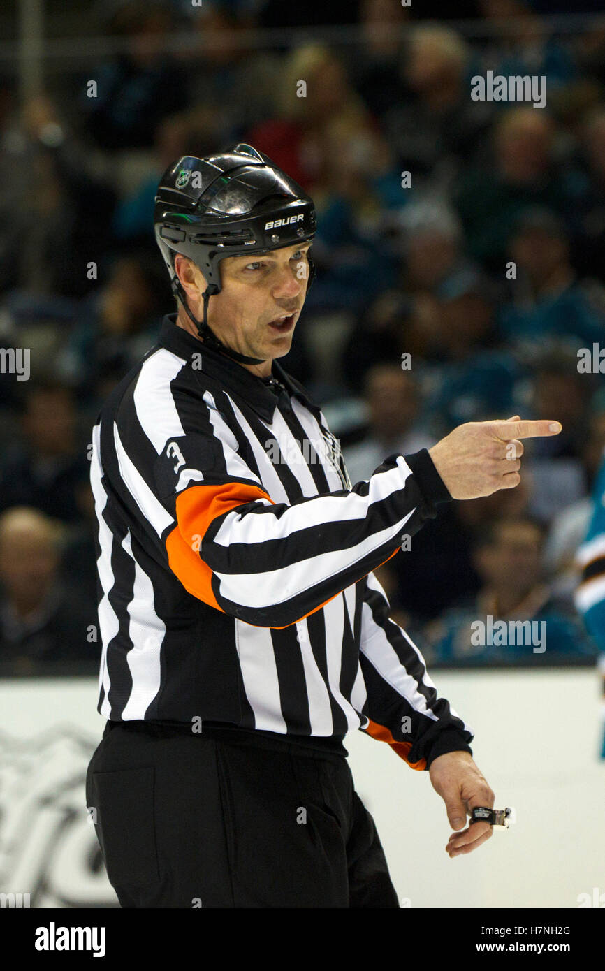 Jan 31, 2012; San Jose, CA, USA; NHL referee Mike Leggo (3) during a stoppage in play between the San Jose Sharks and the Columbus Blue Jackets during the second period at HP Pavilion. San Jose defeated Columbus 6-0. Stock Photo