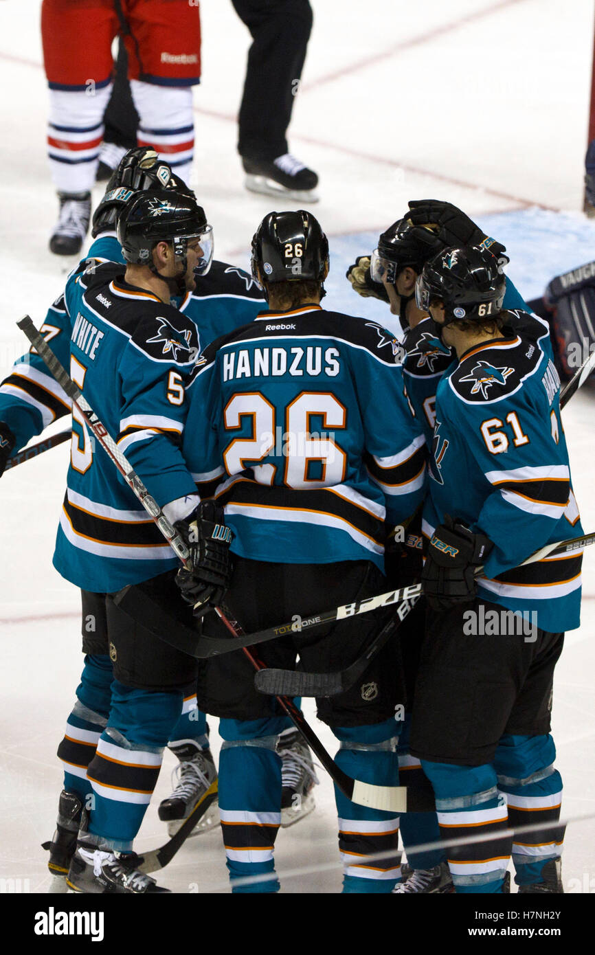 Jan 31, 2012; San Jose, CA, USA; San Jose Sharks center Michal Handzus (26) is congratulated by teammates after scoring a goal against the Columbus Blue Jackets during the third period at HP Pavilion. San Jose defeated Columbus 6-0. Stock Photo