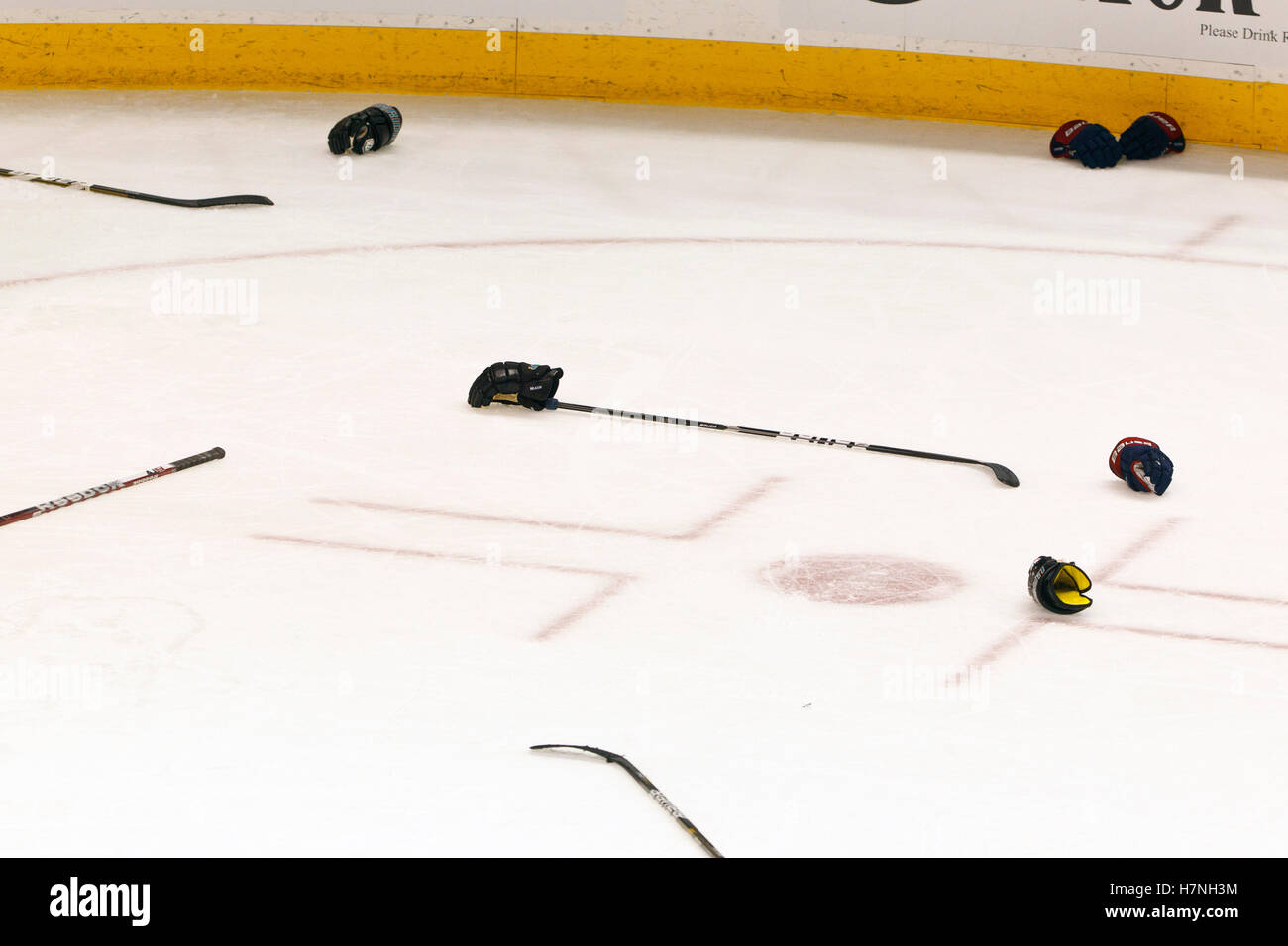 Jan 31, 2012; San Jose, CA, USA; General view of hockey sticks and gloves on the ice after a fight between the San Jose Sharks and the Columbus Blue Jackets during the third period at HP Pavilion. San Jose defeated Columbus 6-0. Stock Photo