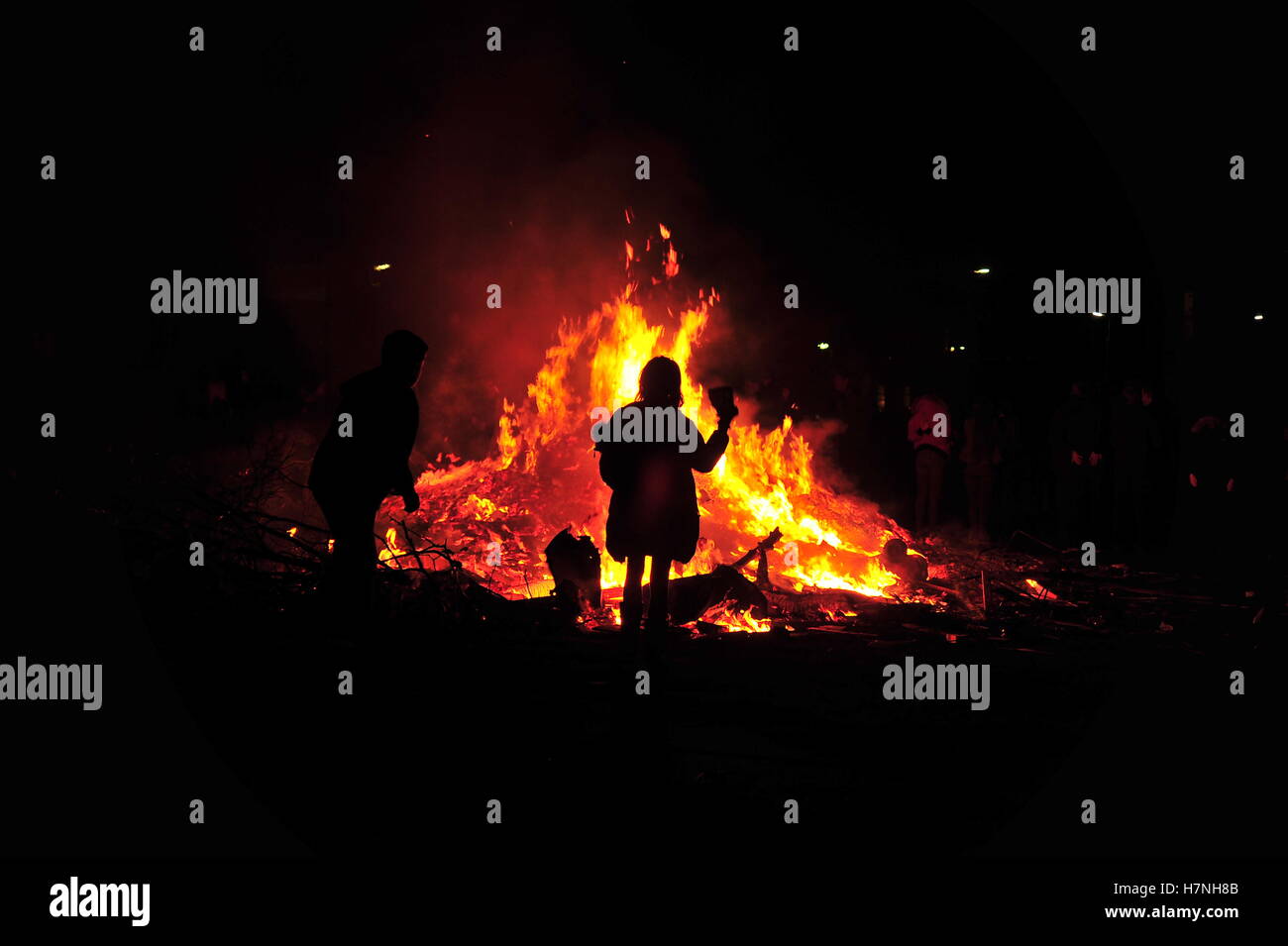 Children throwing wood onto bonfire in Liverpool Stock Photo Alamy