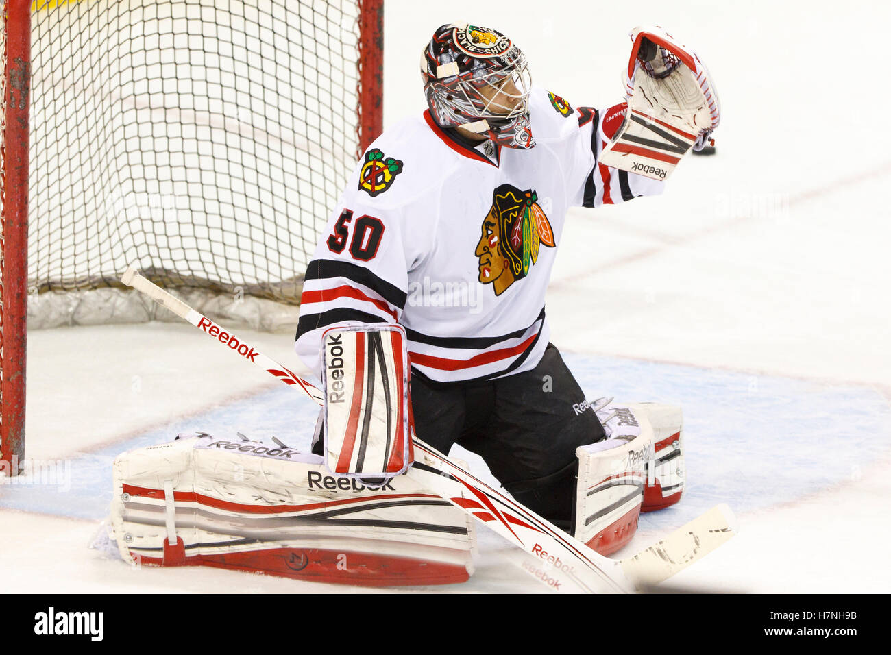 Feb 10, 2012; San Jose, CA, USA; Chicago Blackhawks goalie Corey Crawford (50) warms up before the game against the San Jose Sharks at HP Pavilion. Stock Photo