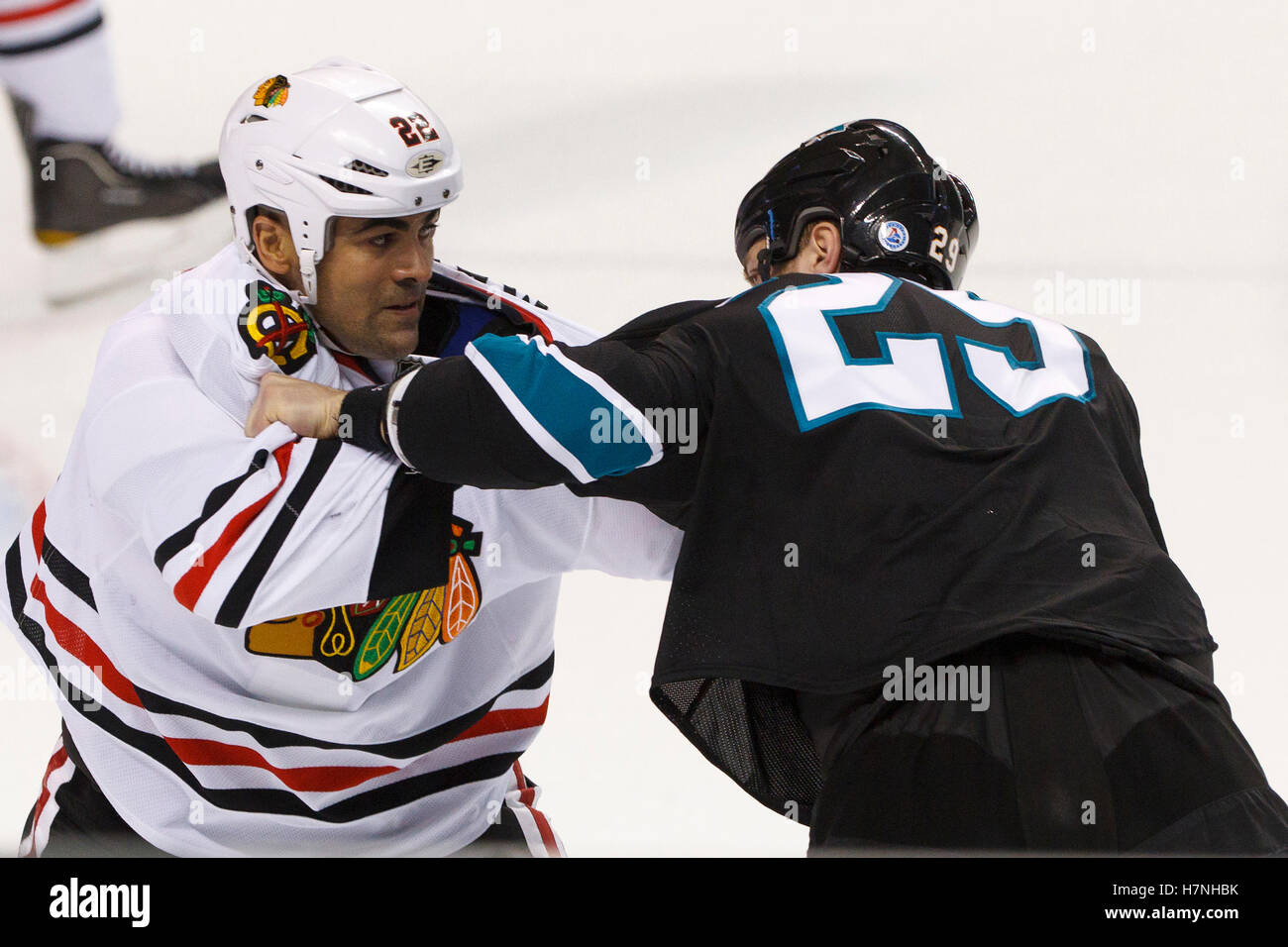 Feb 10, 2012; San Jose, CA, USA; Chicago Blackhawks right wing Jamal Mayers (22) fights San Jose Sharks left wing Ryane Clowe (29) during the first period at HP Pavilion. San Jose defeated Chicago 5-3. Stock Photo