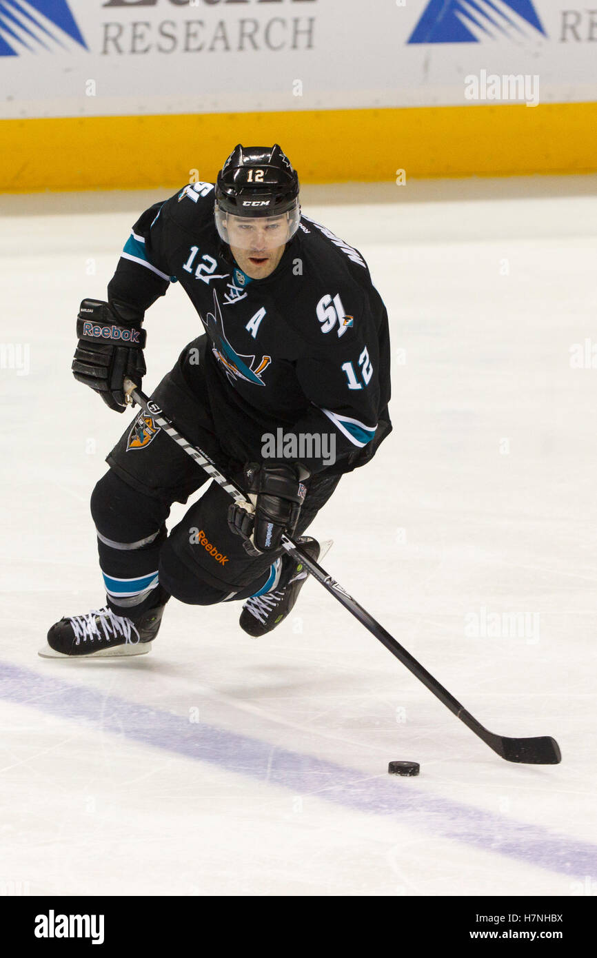 Feb 10, 2012; San Jose, CA, USA; San Jose Sharks left wing Patrick Marleau (12) skates with the puck against the Chicago Blackhawks during the first period at HP Pavilion. San Jose defeated Chicago 5-3. Stock Photo