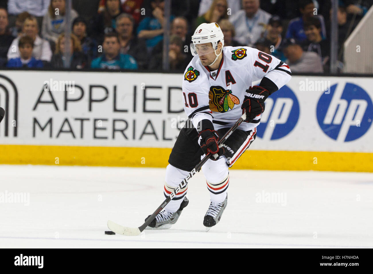 Feb 10, 2012; San Jose, CA, USA; Chicago Blackhawks center Patrick Sharp (10) skates with the puck against the San Jose Sharks during the second period at HP Pavilion. San Jose defeated Chicago 5-3. Stock Photo