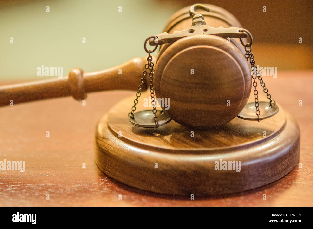 Courtroom concept with gavel and scales, scales of justice holding the scales Stock Photo