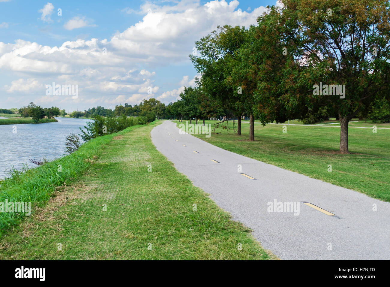 A biking and walking trail beside the North Canadian river next to Overholser lake in Oklahoma City, Oklahoma, USA. Stock Photo