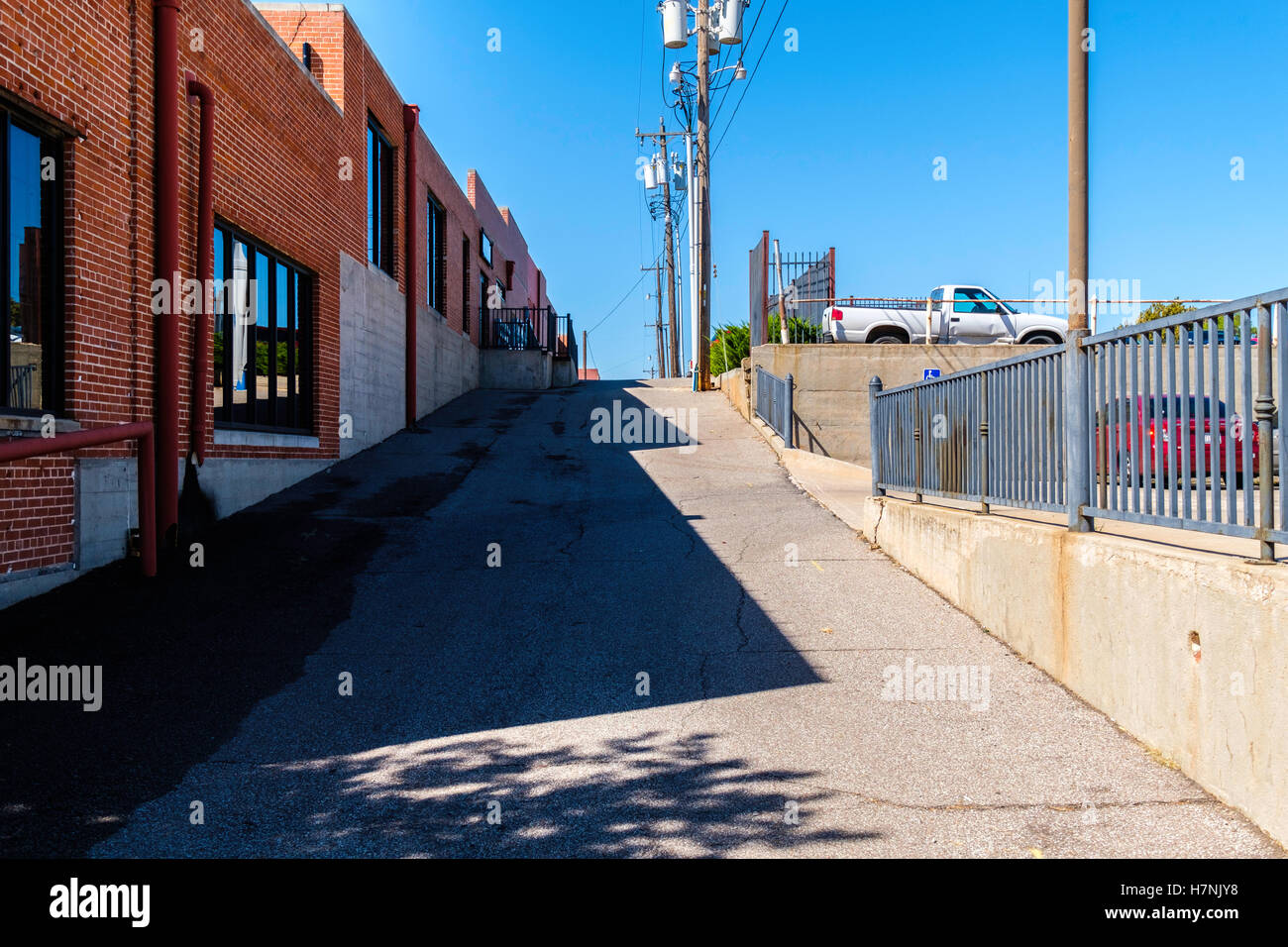 A deserted alleyway in midtown Oklahoma City during the daytime Stock