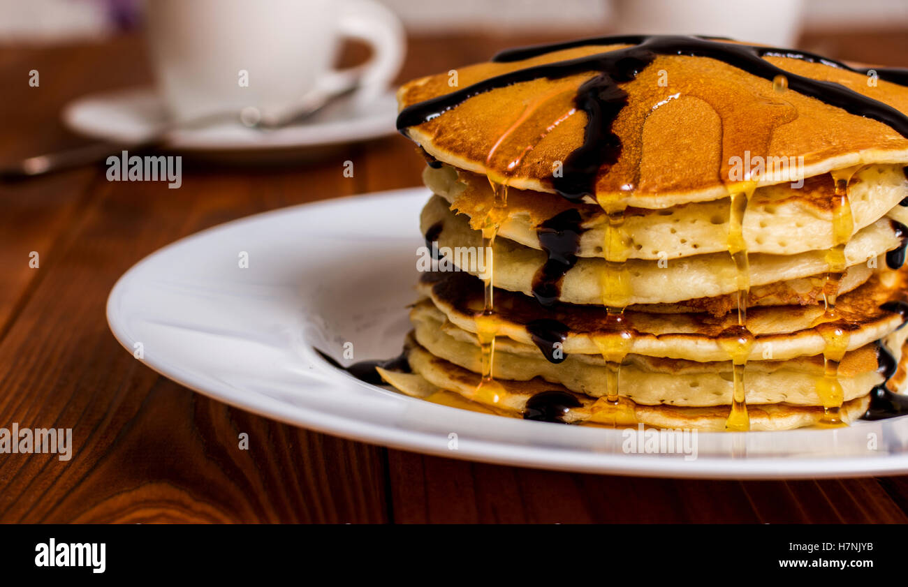 Traditional american breakfast pancakes with maple syrup and chocolate Stock Photo
