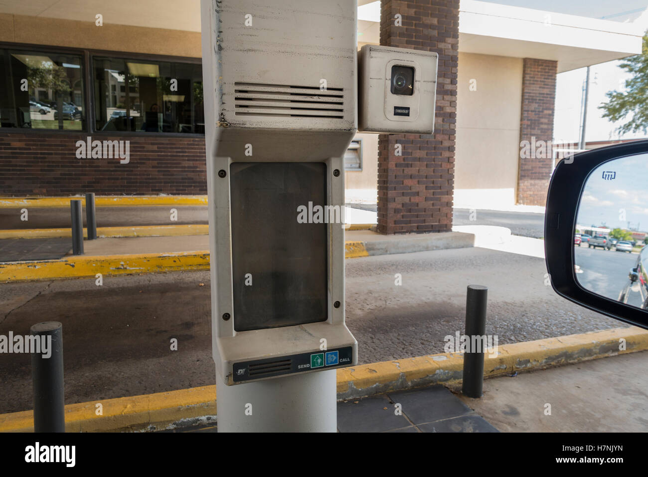 A pneumatic vacuum tube in a drive through area of a bank in Oklahoma City, Oklahoma, USA. Stock Photo
