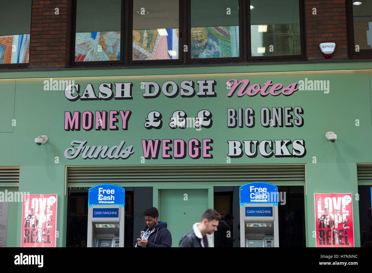 Cash dosh notes money big ones funds wedge bucks. ATMs in Soho London Stock Photo
