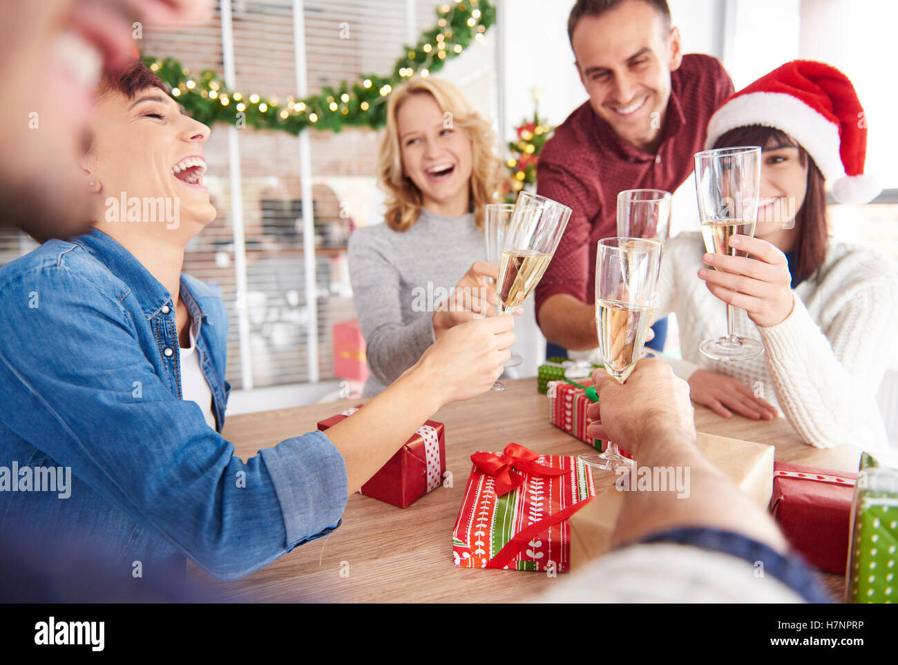Young team having laughs while making a toast Stock Photo
