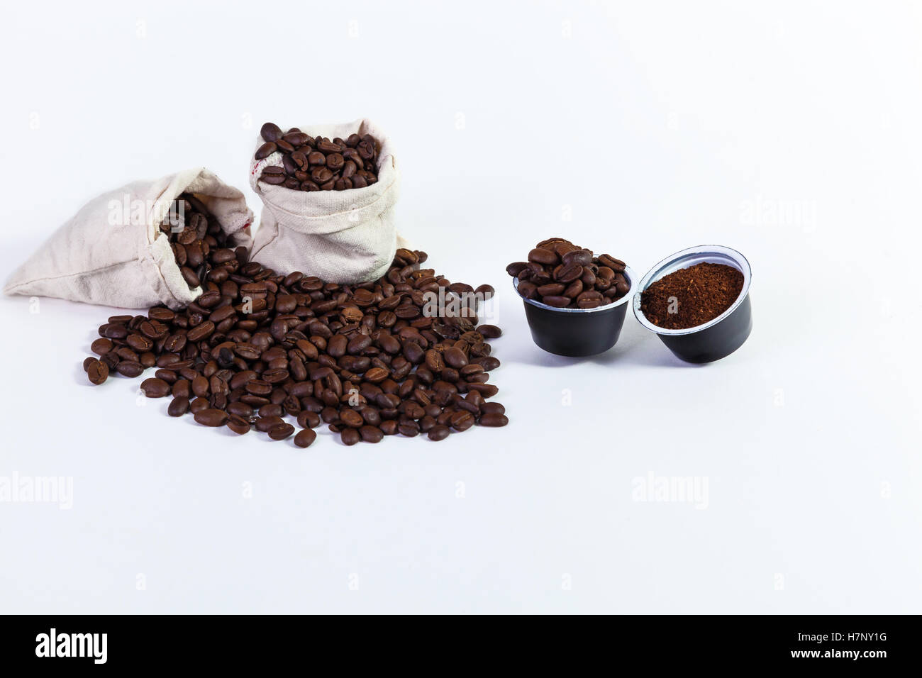 capsules of ground coffee for coffee, roasted coffee beans in a rag