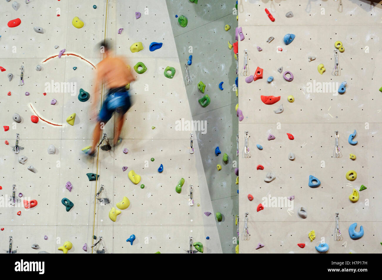 Man Climbing with Ropes on Climbing Wall Stock Photo Alamy