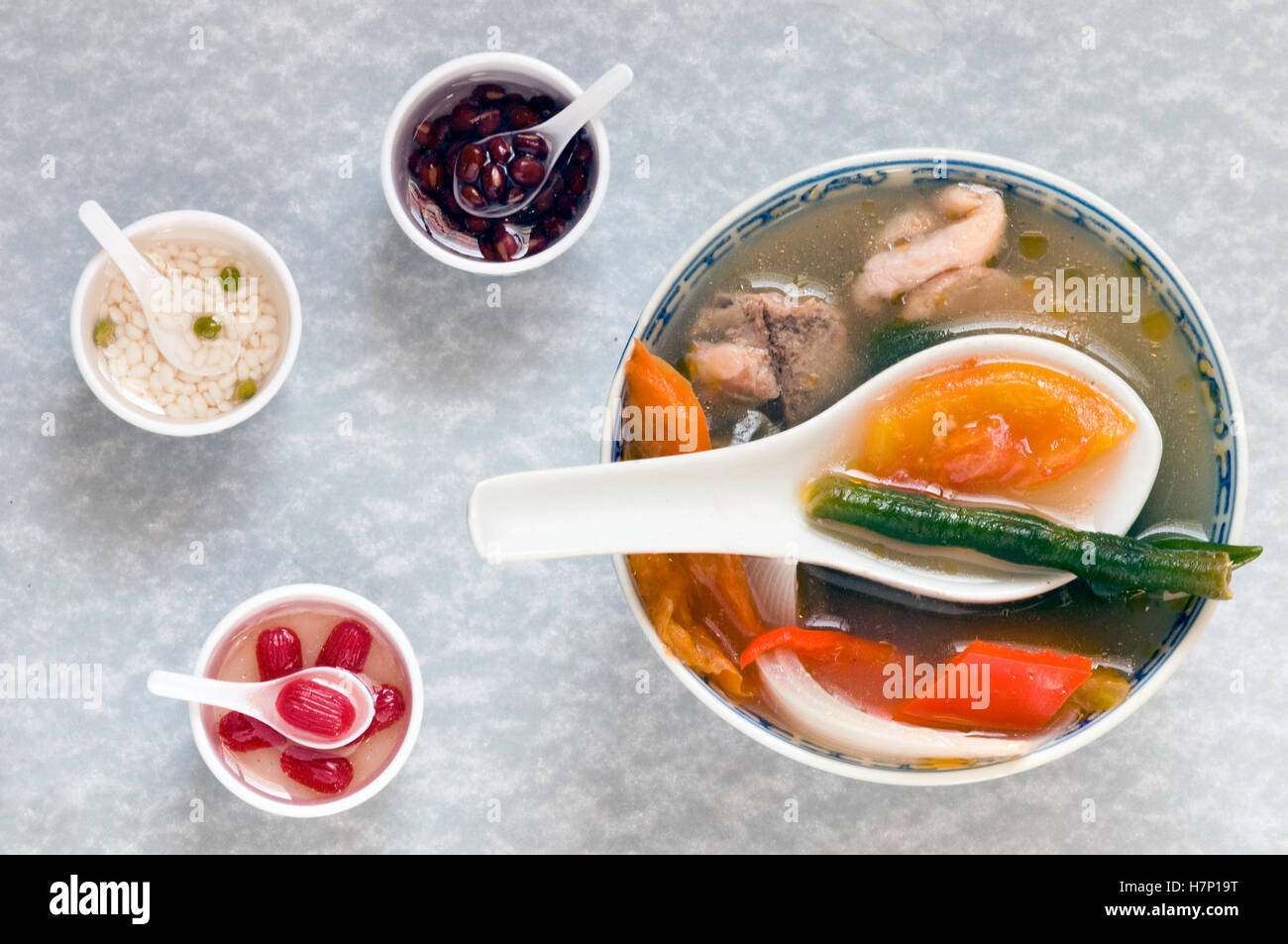 novelty shot of Chinese soup bowl with miniatures Stock Photo Alamy