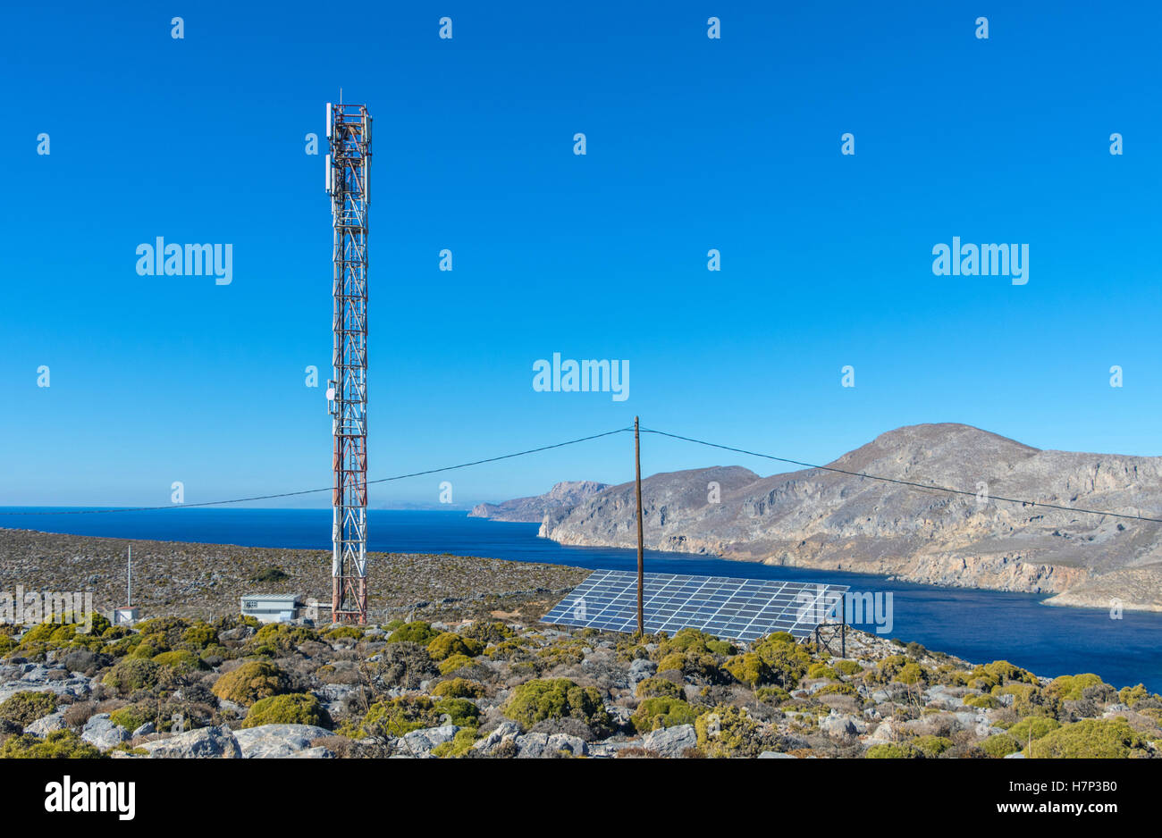 Mobile mast cell phone mast with blue sky and sea Stock Photo
