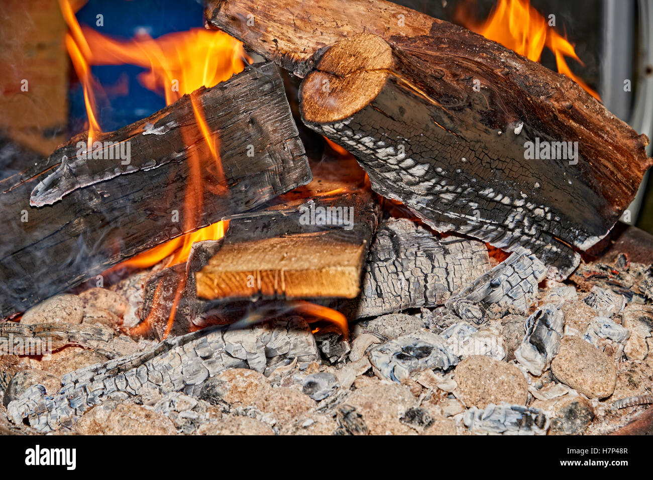 Wood burning in a fire pit in the UK Stock Photo