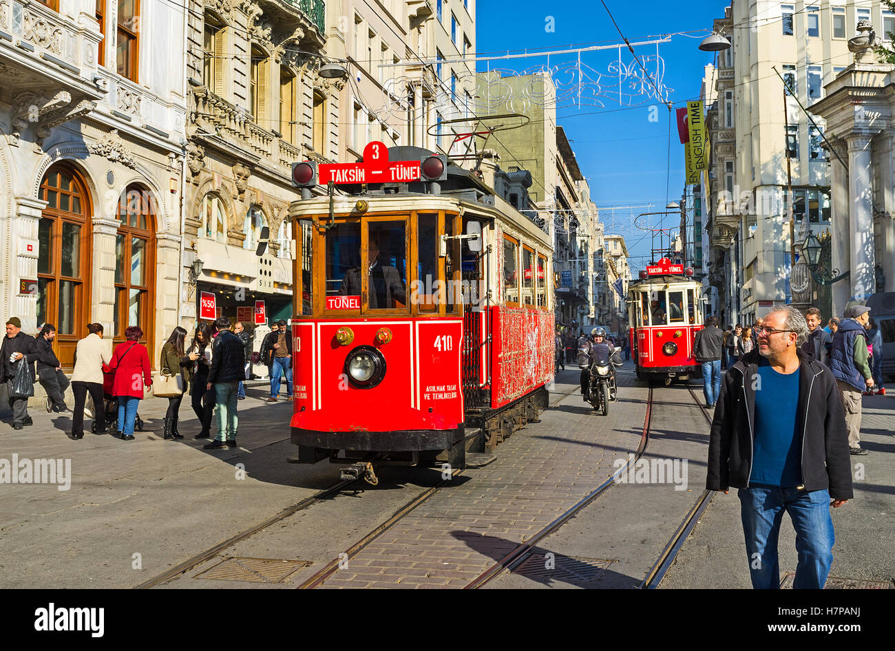 The red retro trams in Independence Avenue departed in different directions: one - to the Taksim Square, another - to the Tunel Stock Photo