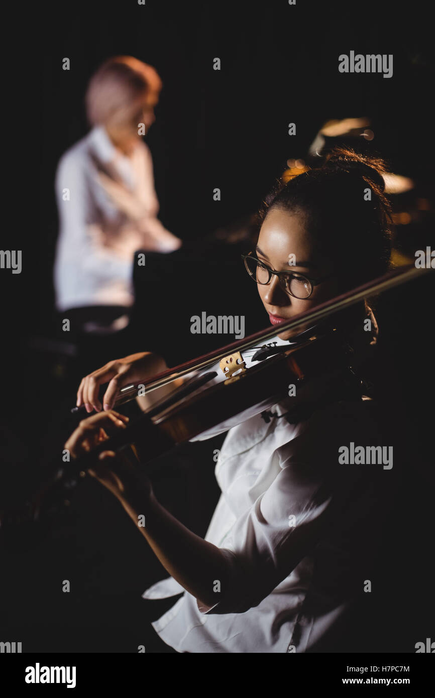 Female student playing violin Stock Photo