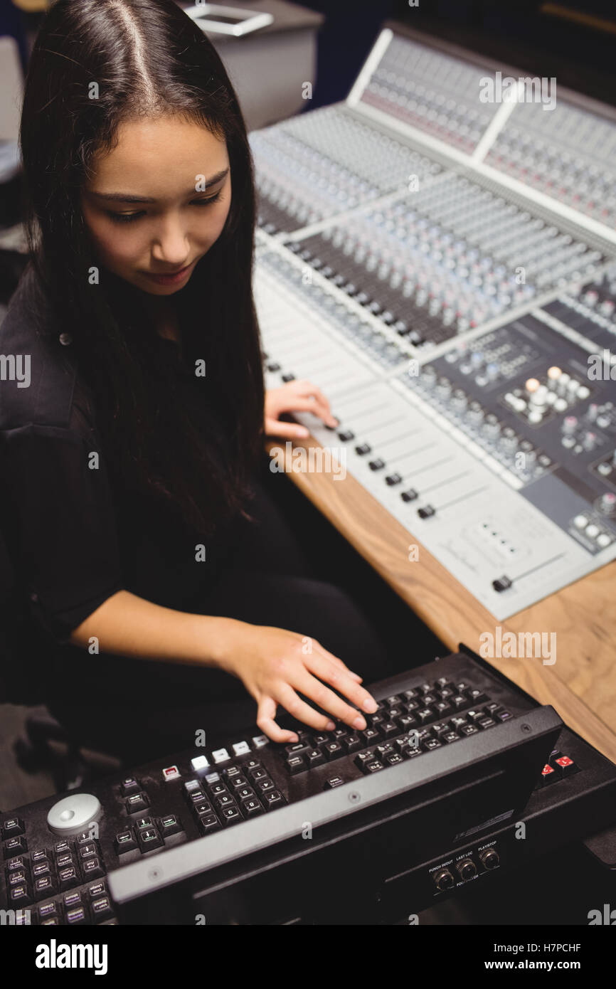 Female student using sound mixer Stock Photo - Alamy