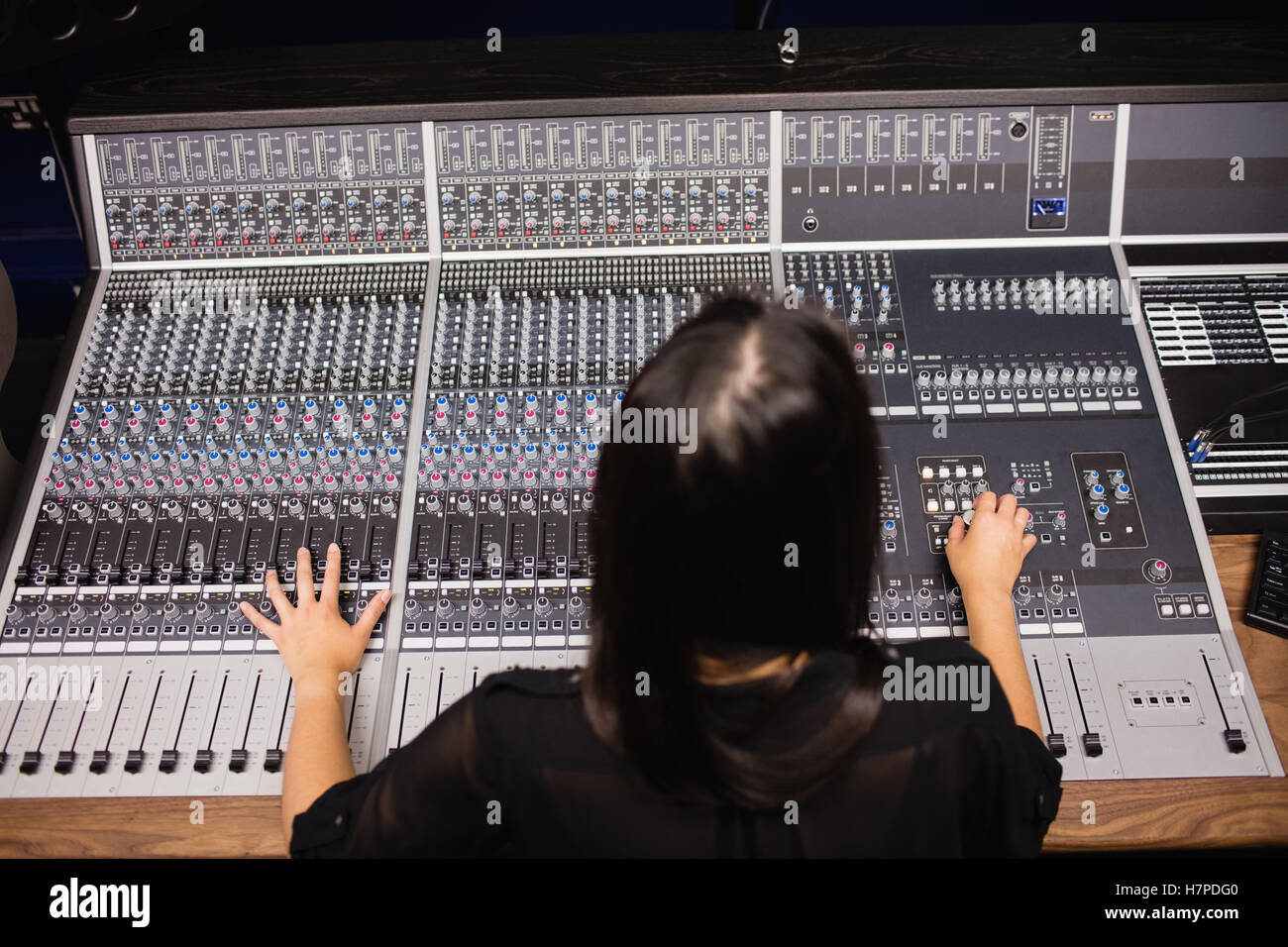 Female student using sound mixer Stock Photo - Alamy