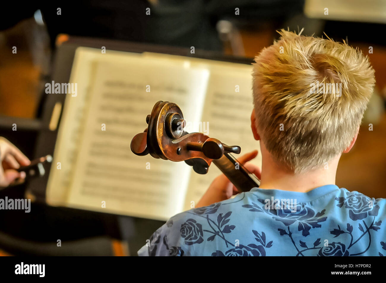 Close up of musical instrument being played by young person Stock Photo