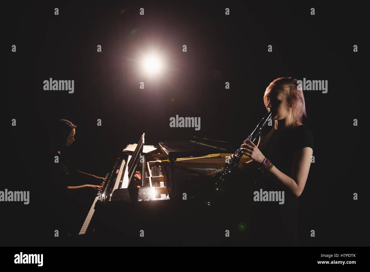 Students playing and piano Stock Photo Alamy