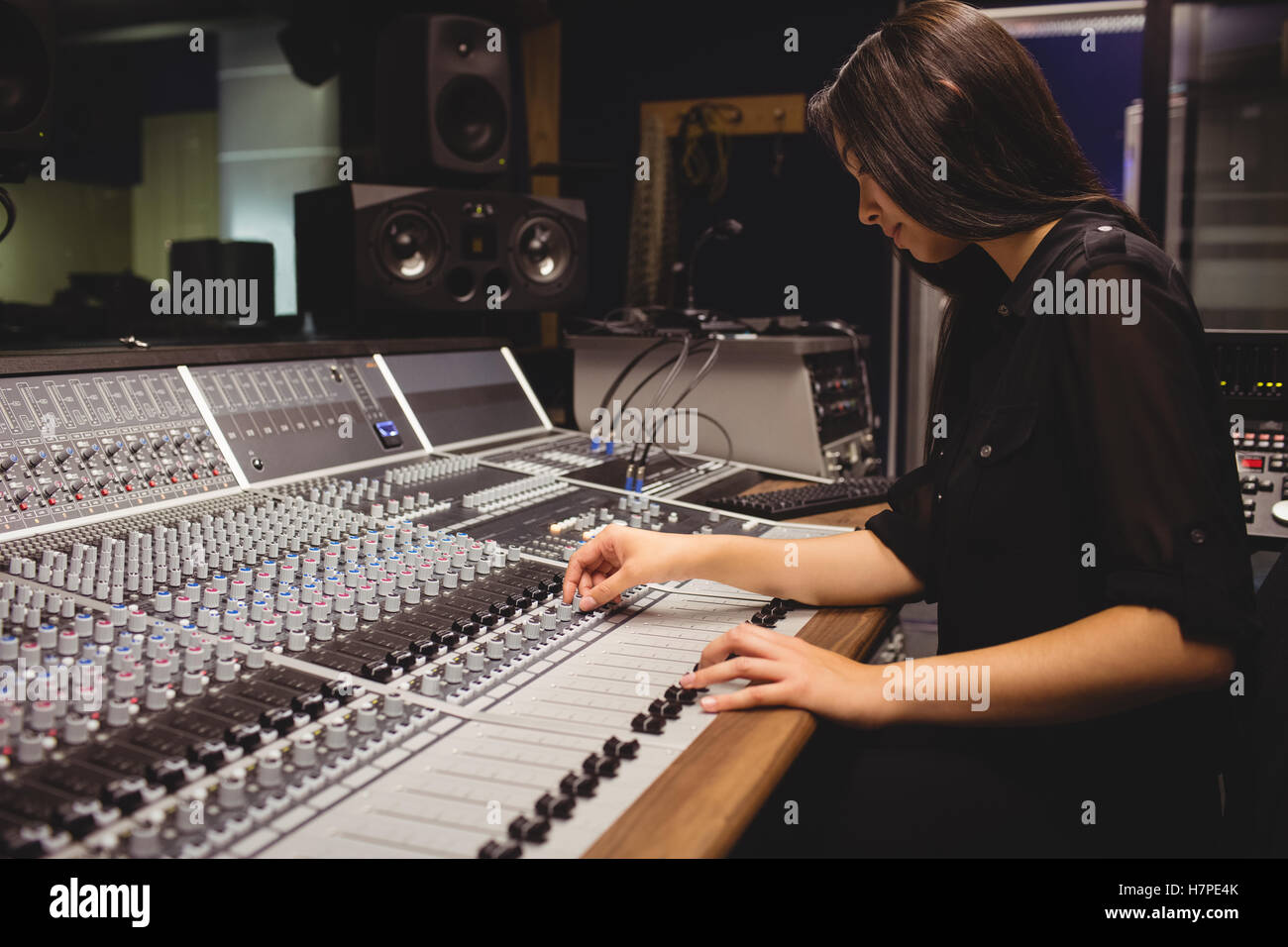 Female student using sound mixer Stock Photo - Alamy
