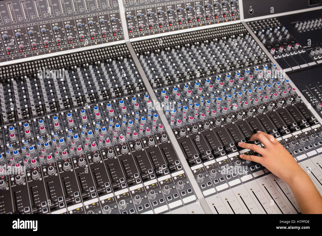 Hand of a female student using sound mixer Stock Photo - Alamy