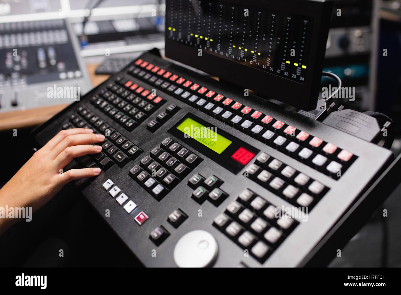Hand of female student using sound mixer keyboard Stock Photo - Alamy