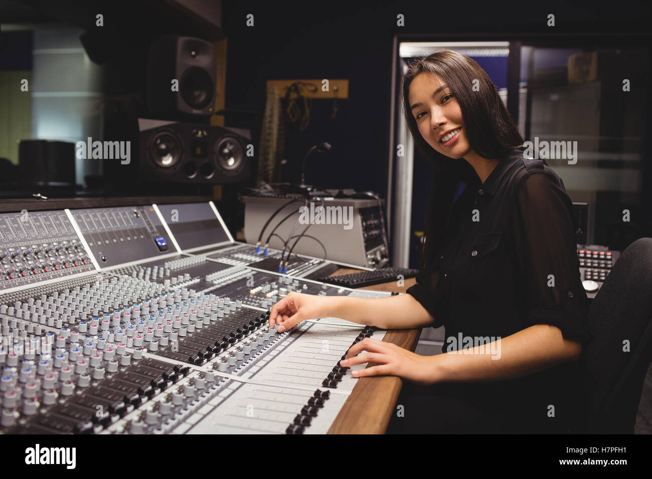 Female student using sound mixer Stock Photo - Alamy