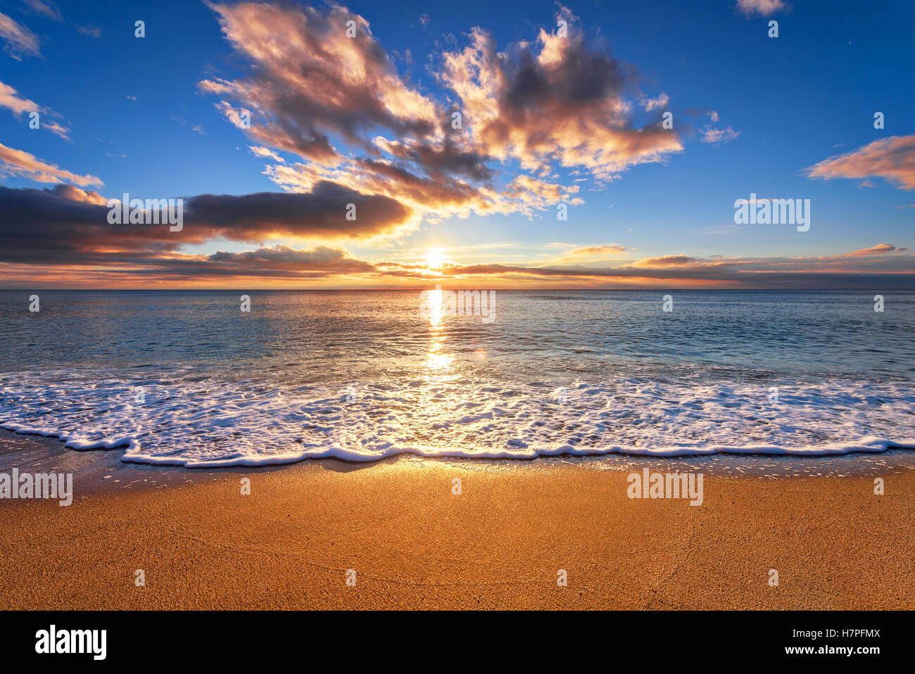 Panoramic dramatic sunset sky and tropical sea at dusk Stock Photo