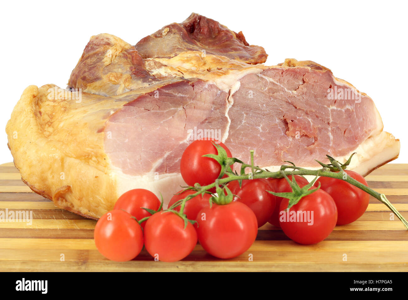 smoked ham and tomatoes on white Stock Photo