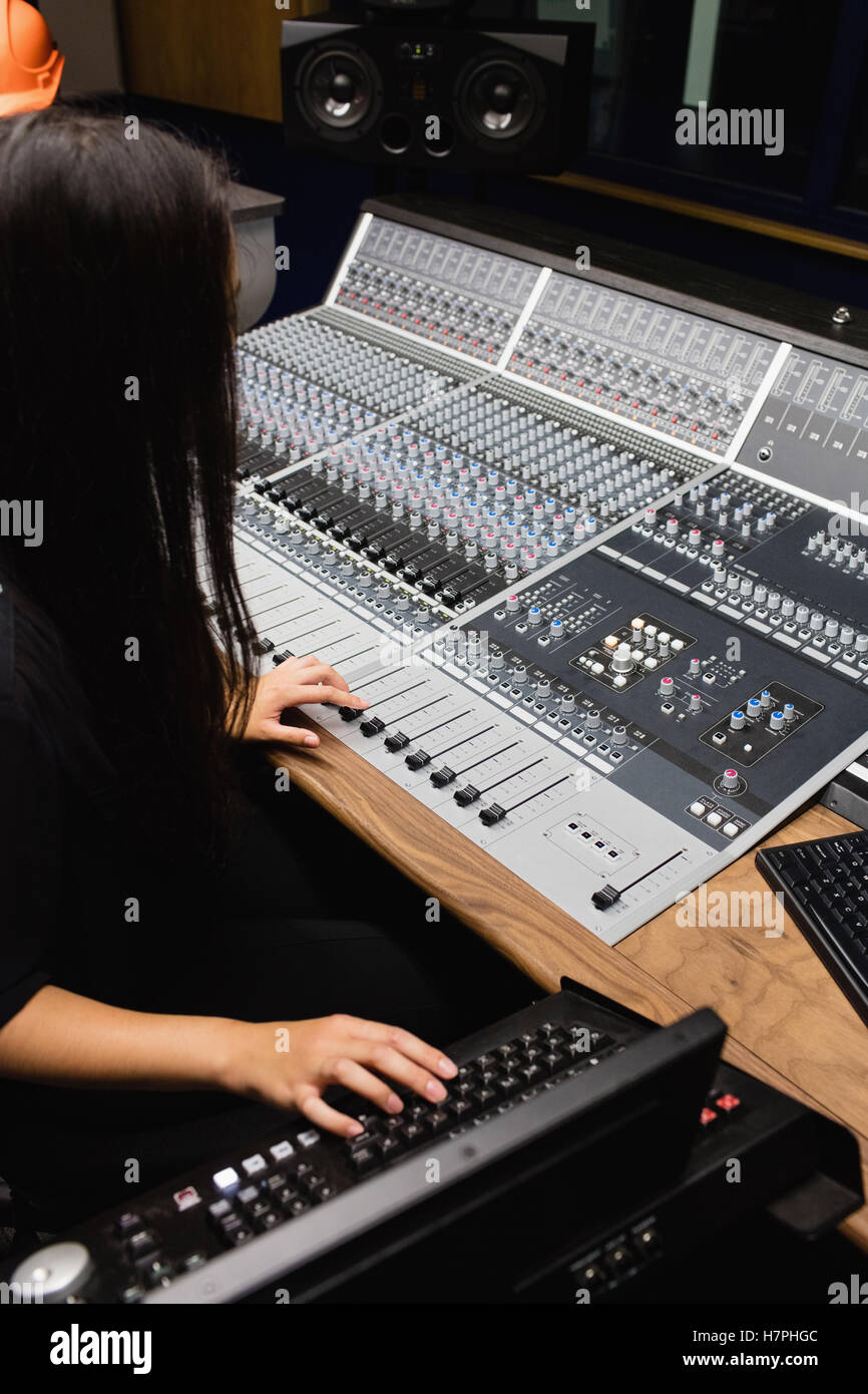 Female student using sound mixer Stock Photo - Alamy