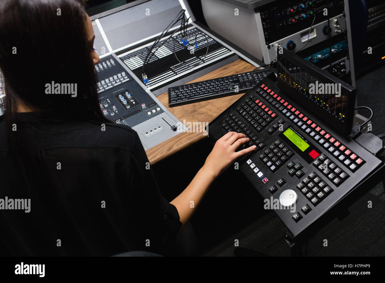 Female student using sound mixer Stock Photo - Alamy