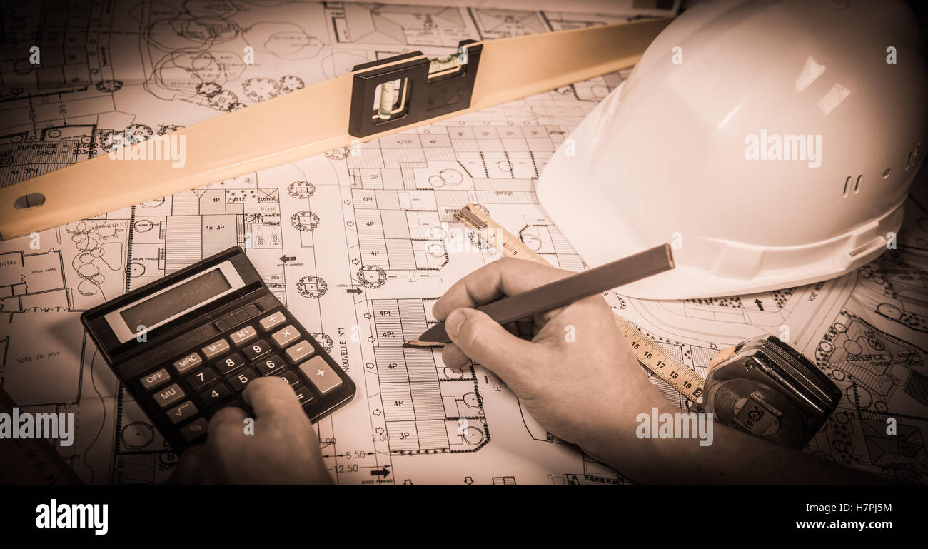 business, architecture, building, construction and people concept ,close up of architect hands with plan Stock Photo