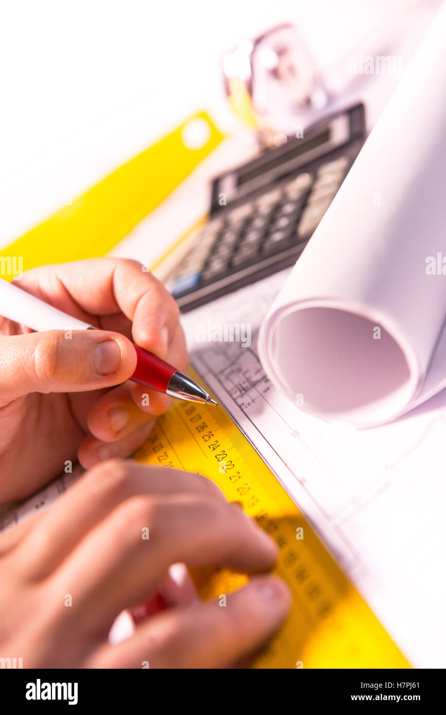 business, architecture, building, construction and people concept ,close up of architect hands with plan Stock Photo