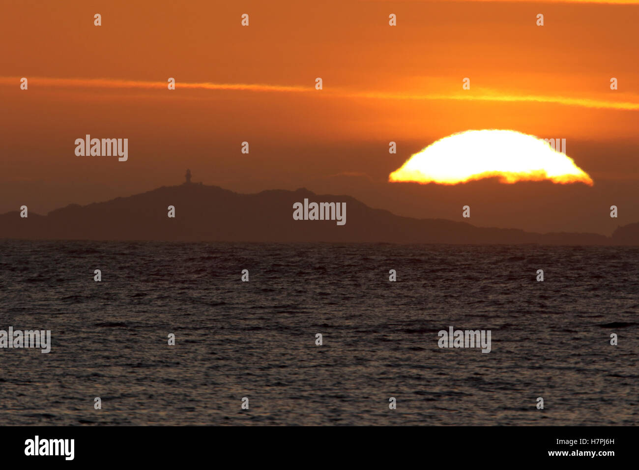 Sunset behind the uninhabited Island of Haskeir  in the Outer Hebrides Stock Photo