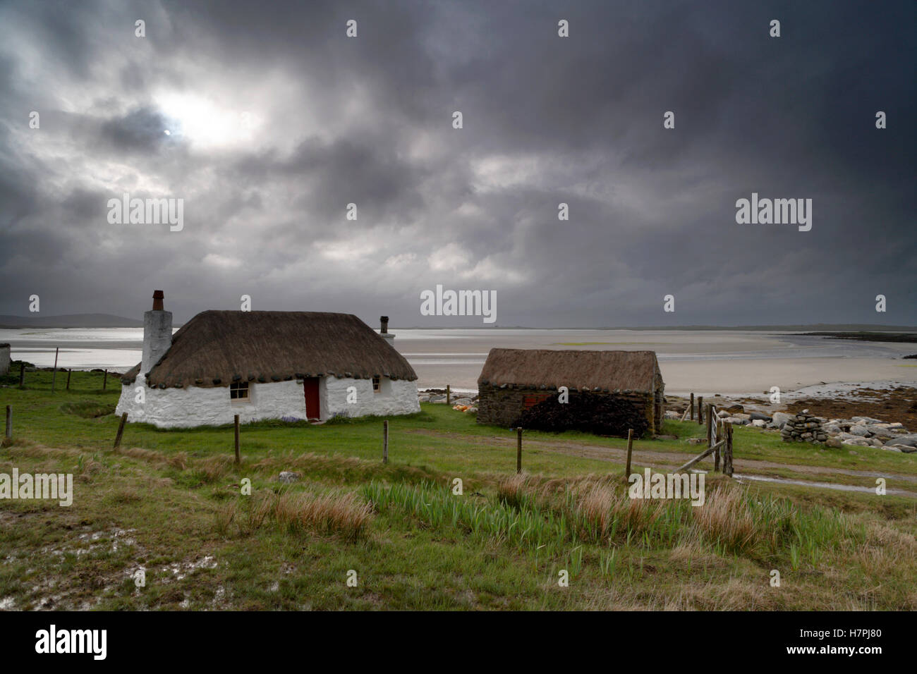 Struan Cottage a crofters home on the side on Vallay strand Malacleit North Uist Scotland Stock Photo