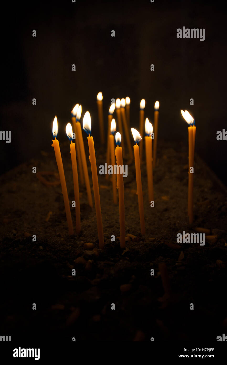 Burning candles over black background Stock Photo