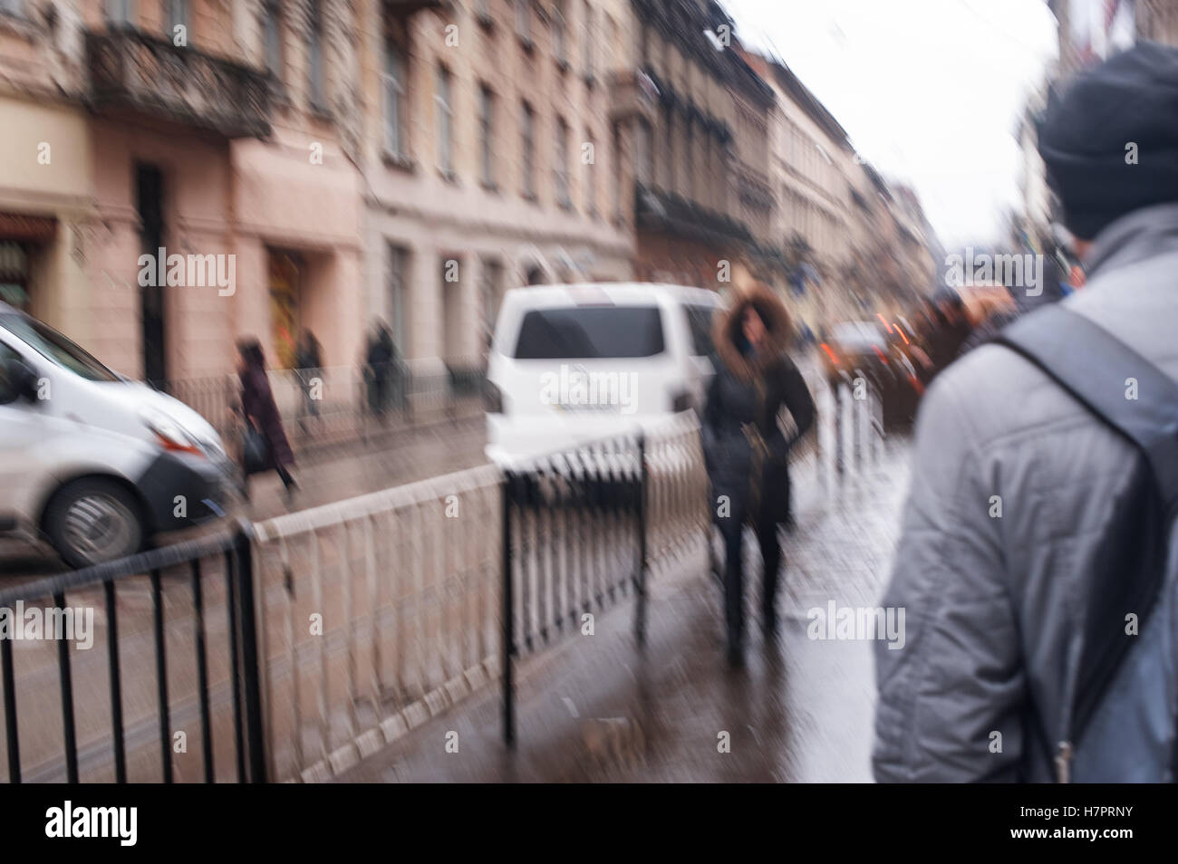 Street with pedestrians and cars on a rainy day Stock Photo - Alamy