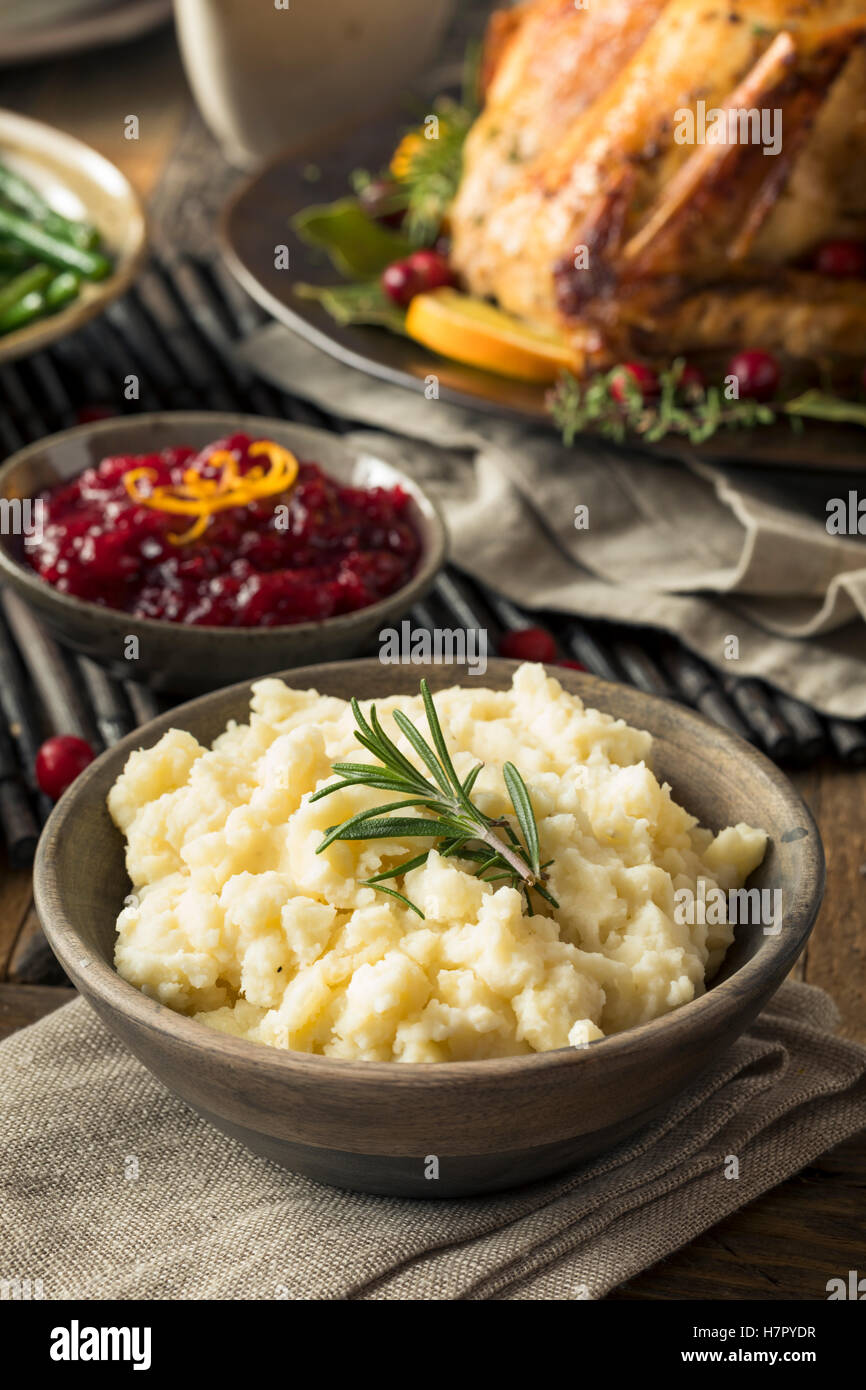 Homemade Thanksgiving Mashed Potatoes with butter and Rosemary Stock Photo