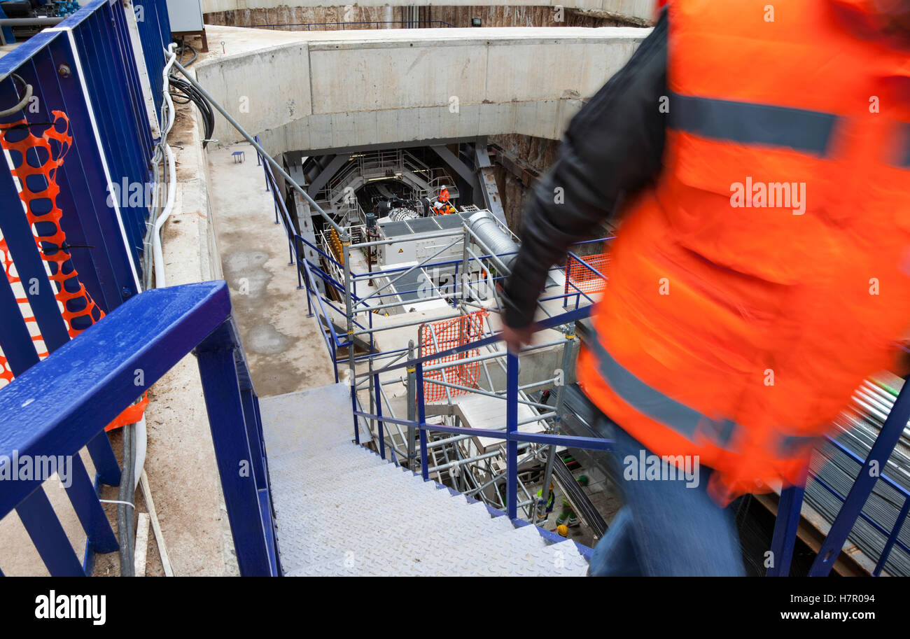 A construction site of an underground with a huge drilling machine at the entrance of a tunnel. Stock Photo